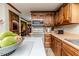 Kitchen with stainless steel appliances, wood cabinets, and views into the dining area at 2642 Holly Springs Church Rd, Broadway, NC 27505