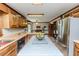 Open kitchen with island, stainless steel appliances, and a breakfast nook in the distance at 2642 Holly Springs Church Rd, Broadway, NC 27505