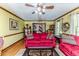Living room featuring hardwood floors, colorful sofas and open view to the entryway at 2642 Holly Springs Church Rd, Broadway, NC 27505
