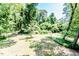 The property is on a wooded lot with many mature trees and shade at 2642 Holly Springs Church Rd, Broadway, NC 27505