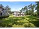 Expansive backyard with well-manicured lawn showcasing the home's exterior and landscaping at 2713 Trifle Lane Ln, Wake Forest, NC 27587
