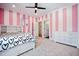Cheerful bedroom with pink and white striped walls, ceiling fan, and white furniture set at 2713 Trifle Lane Ln, Wake Forest, NC 27587
