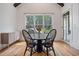 Bright breakfast nook featuring a round table, stylish chairs, and a large window with a green view at 2713 Trifle Lane Ln, Wake Forest, NC 27587