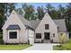 Stunning brick home boasts a manicured lawn, attached garage, and stately architectural details at 2713 Trifle Lane Ln, Wake Forest, NC 27587