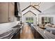 Gourmet kitchen featuring a long island, premium appliances, and a seamless flow to the dining area at 2713 Trifle Lane Ln, Wake Forest, NC 27587