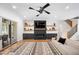 Cozy living room with a fireplace, built-in shelves, and a sliding glass door to the outdoors at 2713 Trifle Lane Ln, Wake Forest, NC 27587
