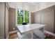 Bright office featuring a built-in desk and bench with a view of the backyard at 2713 Trifle Lane Ln, Wake Forest, NC 27587