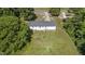 Aerial view of the house showing the backyard, deck, and surrounding landscape at 282 Cooke Rd, Louisburg, NC 27549
