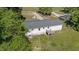 Aerial perspective of the house and yard, highlighting the landscaping and surrounding nature at 282 Cooke Rd, Louisburg, NC 27549