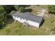 Aerial view of the house showcasing the backyard with a deck and trees at 282 Cooke Rd, Louisburg, NC 27549