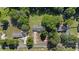 Aerial view of the property highlighting the house, yard, driveway, and surrounding trees at 282 Cooke Rd, Louisburg, NC 27549