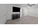 Bedroom boasts a dresser, TV, closet, and laminate flooring at 282 Cooke Rd, Louisburg, NC 27549