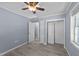 Bedroom boasts neutral walls and modern laminate floors, with entry to closet and hallway at 282 Cooke Rd, Louisburg, NC 27549