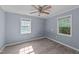 This bedroom is illuminated by natural light and features a ceiling fan and laminate floors at 282 Cooke Rd, Louisburg, NC 27549