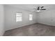 Bedroom features two windows bringing in natural light, updated flooring, and a ceiling fan at 282 Cooke Rd, Louisburg, NC 27549