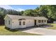 A lovely single-story home shows off a bay window, covered porch, and paved driveway in a serene, wooded neighborhood at 282 Cooke Rd, Louisburg, NC 27549