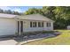 This ranch home boasts a covered front porch, landscape lighting, and a peaceful setting, perfect for relaxing outdoors at 282 Cooke Rd, Louisburg, NC 27549