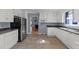 Well-lit kitchen features white cabinets, dark countertops, and stainless steel appliances at 282 Cooke Rd, Louisburg, NC 27549