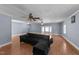 Spacious living room features hardwood flooring, and multiple windows, offering a welcoming and comfortable living space at 282 Cooke Rd, Louisburg, NC 27549