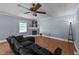 Inviting living room features a ceiling fan, fireplace, and comfortable seating at 282 Cooke Rd, Louisburg, NC 27549