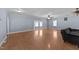 Spacious living room with wood flooring, crown molding, and lots of natural light at 282 Cooke Rd, Louisburg, NC 27549