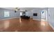 The spacious living room features hardwood floors, a decorative fireplace, and windows that provide lots of natural light at 282 Cooke Rd, Louisburg, NC 27549