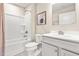 Cozy bathroom featuring a single vanity, tub shower, toilet, and light grey walls at 303 Rothbury Ct, Sanford, NC 27330