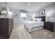 Comfortable bedroom with plush carpet, stylish decor, and a bright window view at 303 Rothbury Ct, Sanford, NC 27330