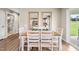 Open concept dining area with views to the kitchen and patio doors leading to the outdoor space at 303 Rothbury Ct, Sanford, NC 27330
