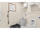 Well-organized laundry room featuring wire shelving and a gray pet bed, offering functionality and convenience at 303 Rothbury Ct, Sanford, NC 27330
