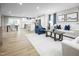 Open-concept living space with stylish furniture and easy access to both the kitchen and dining areas at 303 Rothbury Ct, Sanford, NC 27330