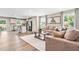 Spacious living room featuring a comfortable sofa, stylish decor, and plenty of natural light at 303 Rothbury Ct, Sanford, NC 27330