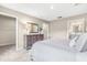 Spacious main bedroom with a dresser, large bed and access to a walk-in closet and main bathroom at 303 Rothbury Ct, Sanford, NC 27330