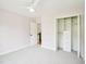 This bedroom has a ceiling fan and a closet with shelves and drawers at 305 Promontory Point Dr, Cary, NC 27513