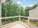 Enjoy the view from this spacious deck with black metal railings and a wood floor at 305 Promontory Point Dr, Cary, NC 27513