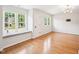This living room has wood floors and a window seat at 305 Promontory Point Dr, Cary, NC 27513