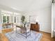 The office includes hardwood floors, natural light, and calming views of the outdoor scenery at 305 Promontory Point Dr, Cary, NC 27513