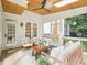 Charming screened-in patio featuring a ceiling fan, wood ceiling and plenty of seating at 305 Promontory Point Dr, Cary, NC 27513