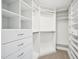 Spacious walk-in closet with custom shelving and ample storage solutions at 305 Promontory Point Dr, Cary, NC 27513