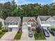 Attractive two-story home with a well-maintained yard, complemented by lush trees at 306 Berlin Way, Morrisville, NC 27560