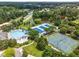 Aerial view featuring a community pool, tennis courts, and a serene pond at 306 Berlin Way, Morrisville, NC 27560