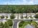 Aerial view of a peaceful residential area with mature trees and a quiet, paved road at 306 Berlin Way, Morrisville, NC 27560