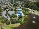 Aerial view of community amenities including tennis courts and a pool near a lake at 306 Berlin Way, Morrisville, NC 27560