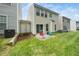 Nice backyard with a grassy lawn, outdoor seating, and a patio for relaxation and entertaining at 306 Berlin Way, Morrisville, NC 27560