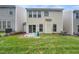 Relaxing backyard with a grassy lawn and a patio area for outdoor enjoyment at 306 Berlin Way, Morrisville, NC 27560