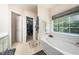 Relaxing bathroom featuring a soaking tub, shower, and walk-in closet at 306 Berlin Way, Morrisville, NC 27560