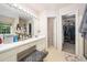Bright bathroom with double sinks, ample counter space, and a walk-in closet at 306 Berlin Way, Morrisville, NC 27560