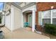 Inviting home entrance with a light-colored door, and a quaint porch at 306 Berlin Way, Morrisville, NC 27560