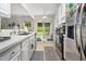 Bright kitchen with sleek stainless steel appliances and view to the backyard at 306 Berlin Way, Morrisville, NC 27560