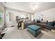Inviting living room with plush sofas and a comfortable ottoman, perfect for relaxation at 306 Berlin Way, Morrisville, NC 27560
